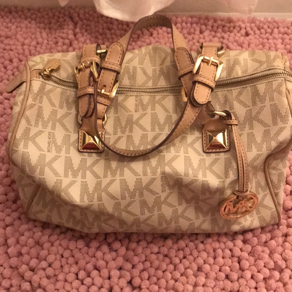 White, tan, and gold Michael Kors purse.